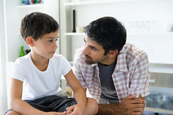 Father and Son Conversation --- Image by © Heide Benser/Corbis