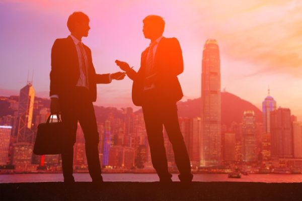 successful business men talk and meeting with office building