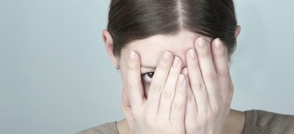 Young woman hiding